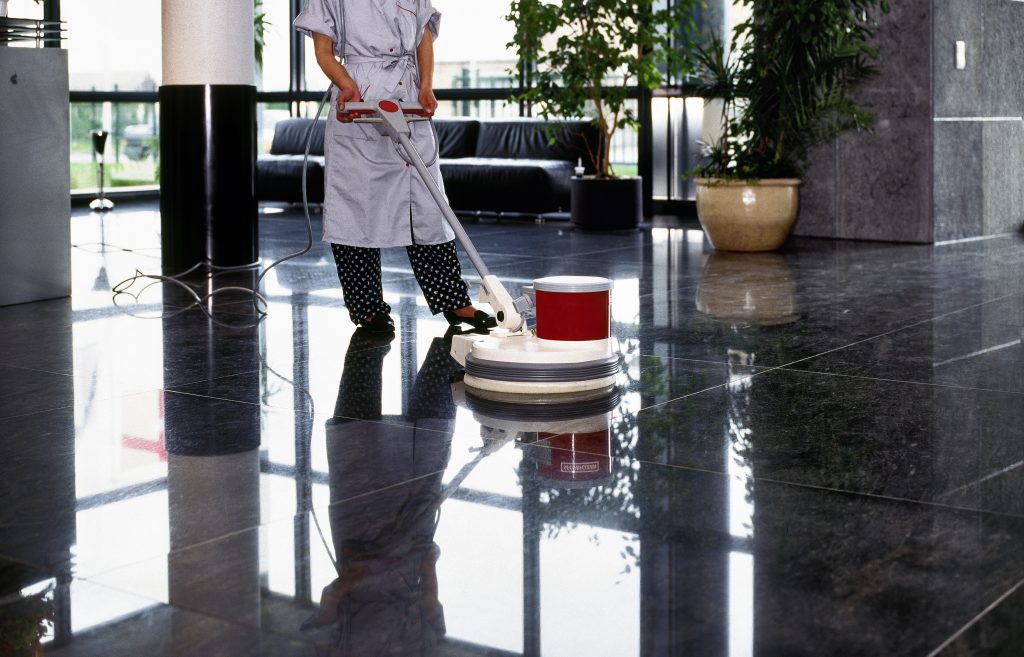 Business floor slip test being conducted in a commercial building