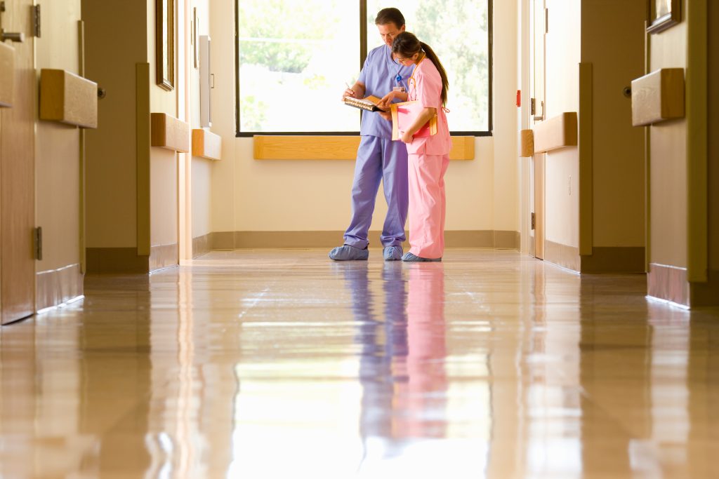 Healthcare facility undergoing a business floor slip test to identify slip hazards